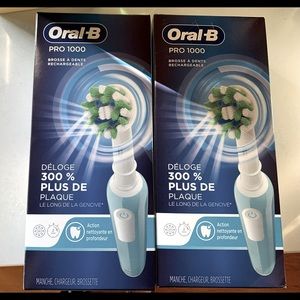 NIB Oral B Pro 100 rechargeable toothbrush’s- set of two